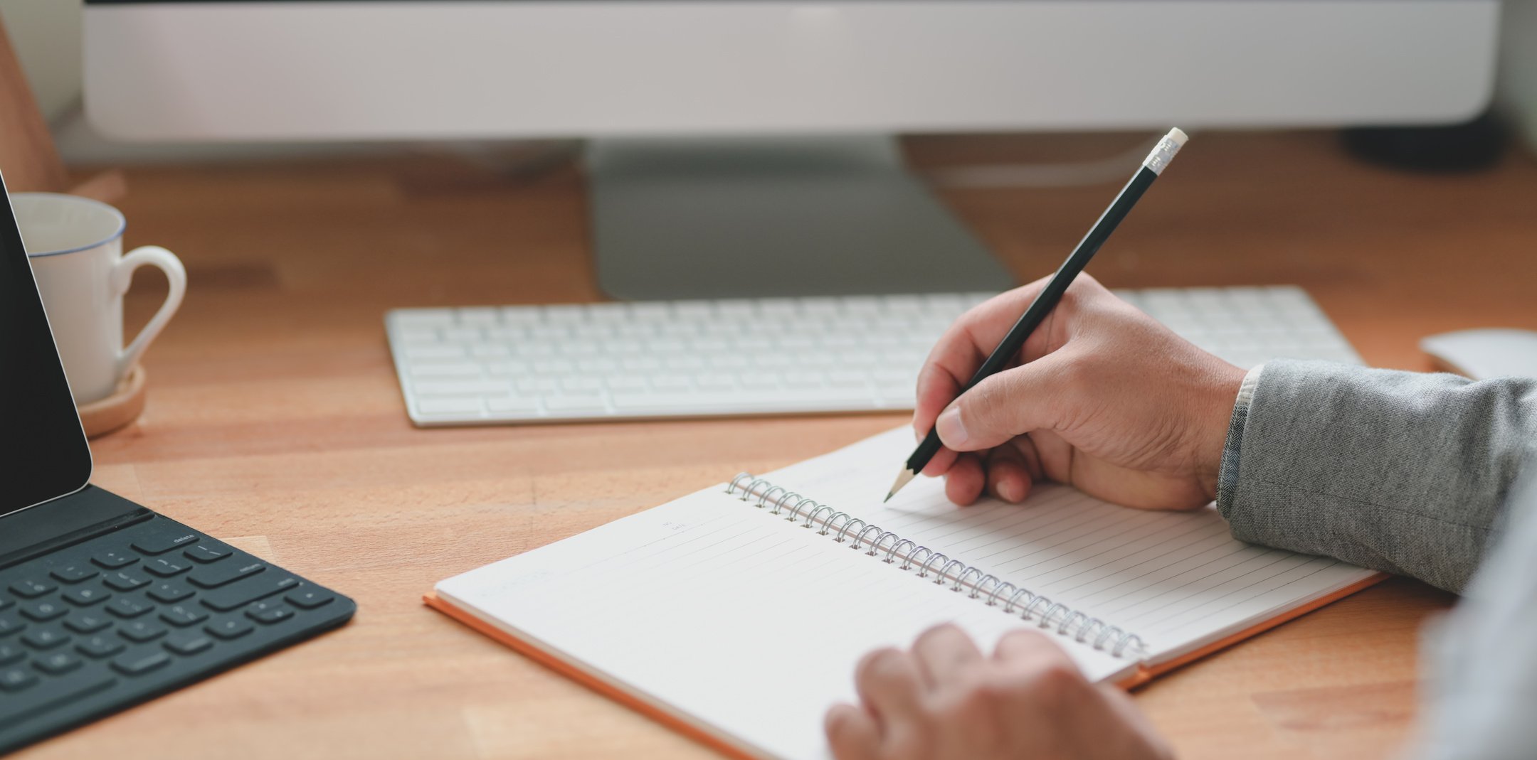 Person Writing on White Paper